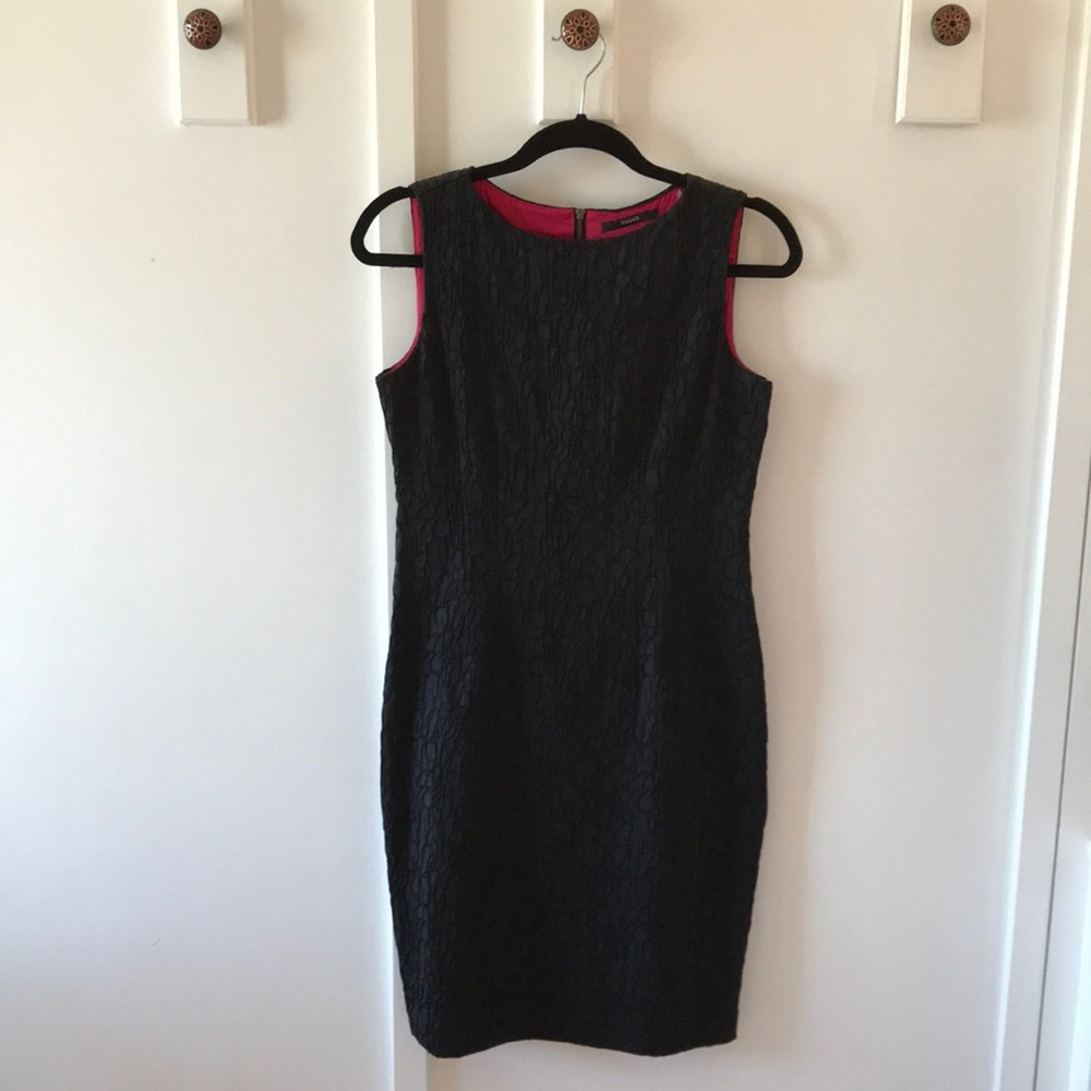 Elegant black dress lined in raspberry material.